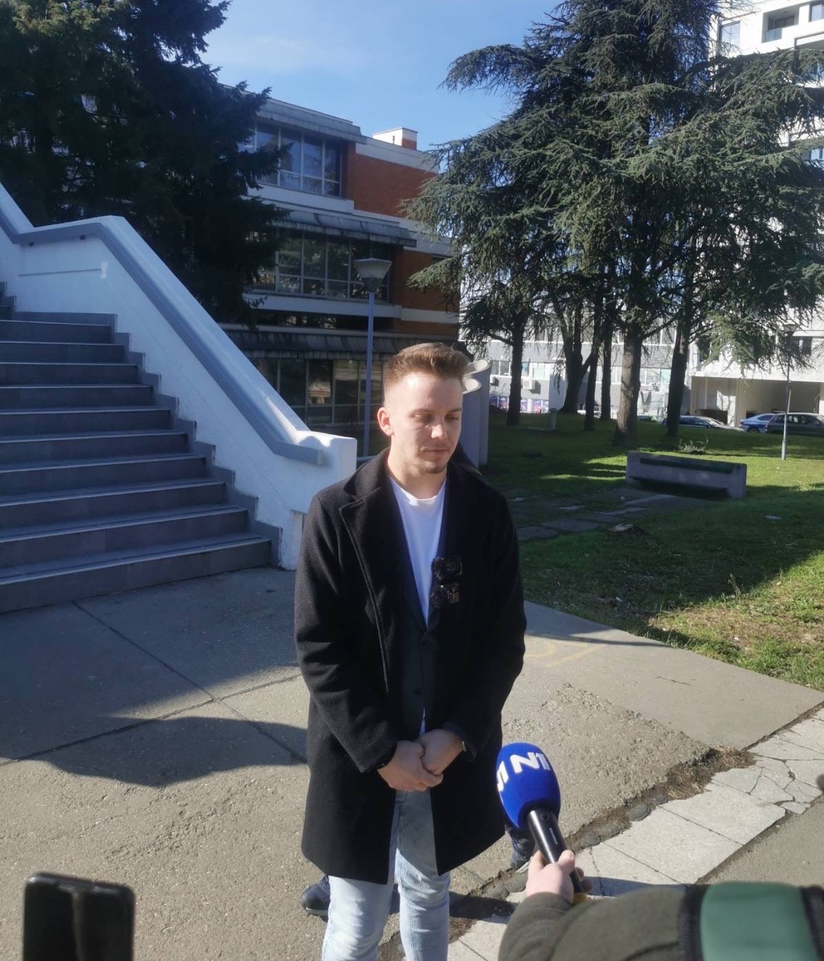 Journalist who covered protest against pro-regime student stands trial for “shouting”